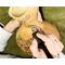 This image shows me drawing the cat artwork. I use pyrography tools or wood-burning pens to engrave artwork into the gourd shell.